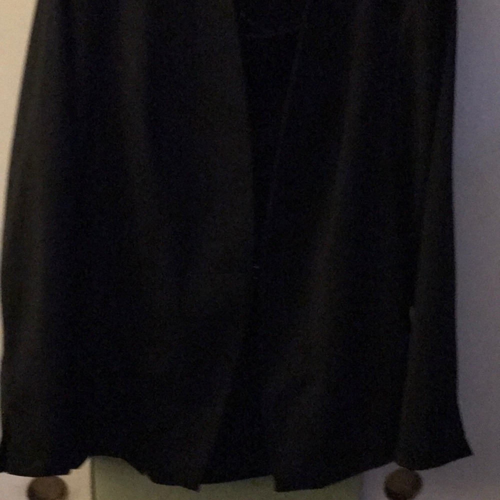 Black crape business suit.